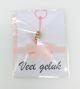 Roze gelukspoppetje